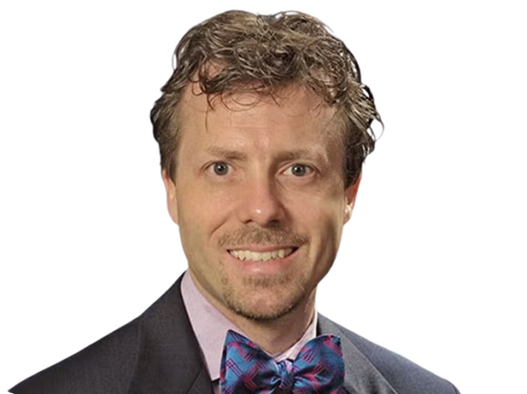 Professional man in a suit and bow tie smiling