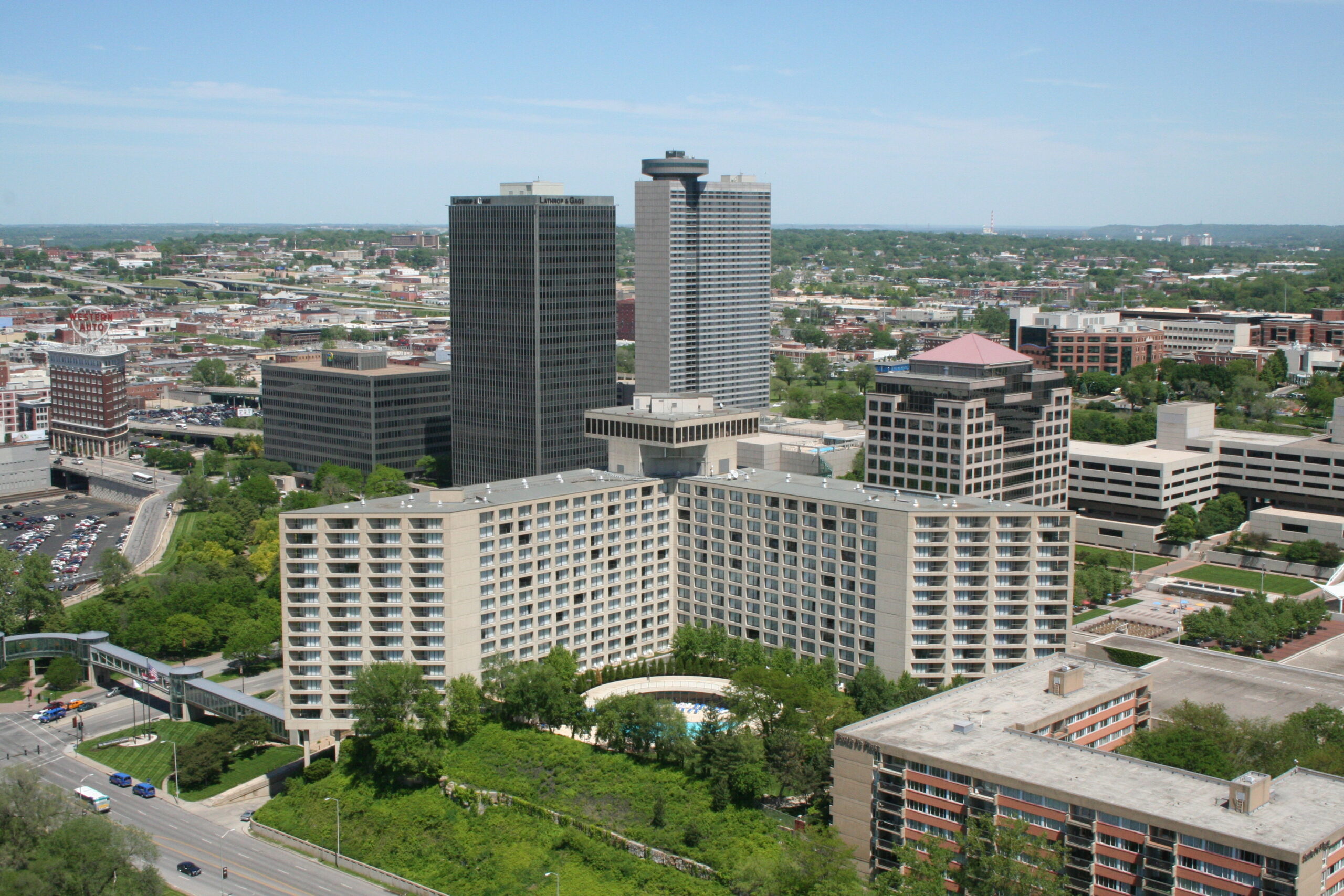 City skyline with modern buildings, including a Lumina Bank tower.